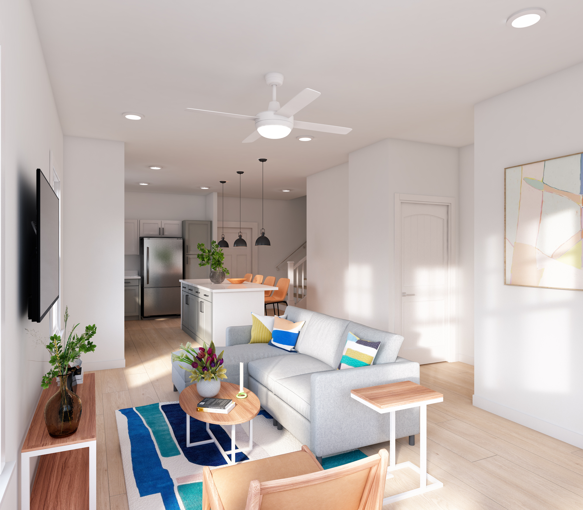 a living room with a couch and a kitchen