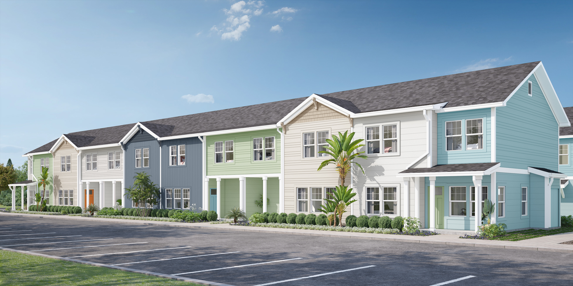 a row of multi-story houses with palm trees and a parking lot