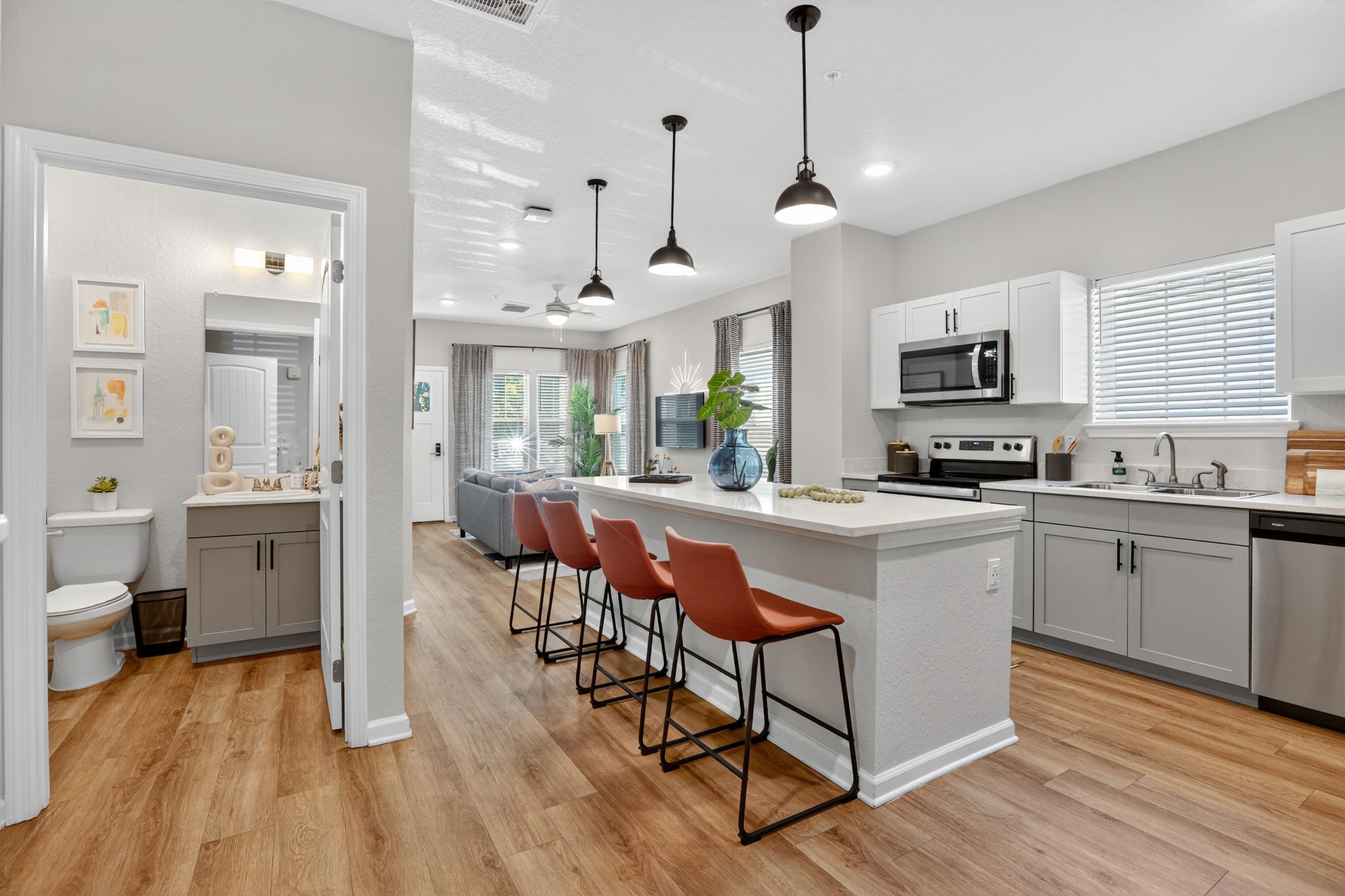 Modern kitchen with guest bathroom access.