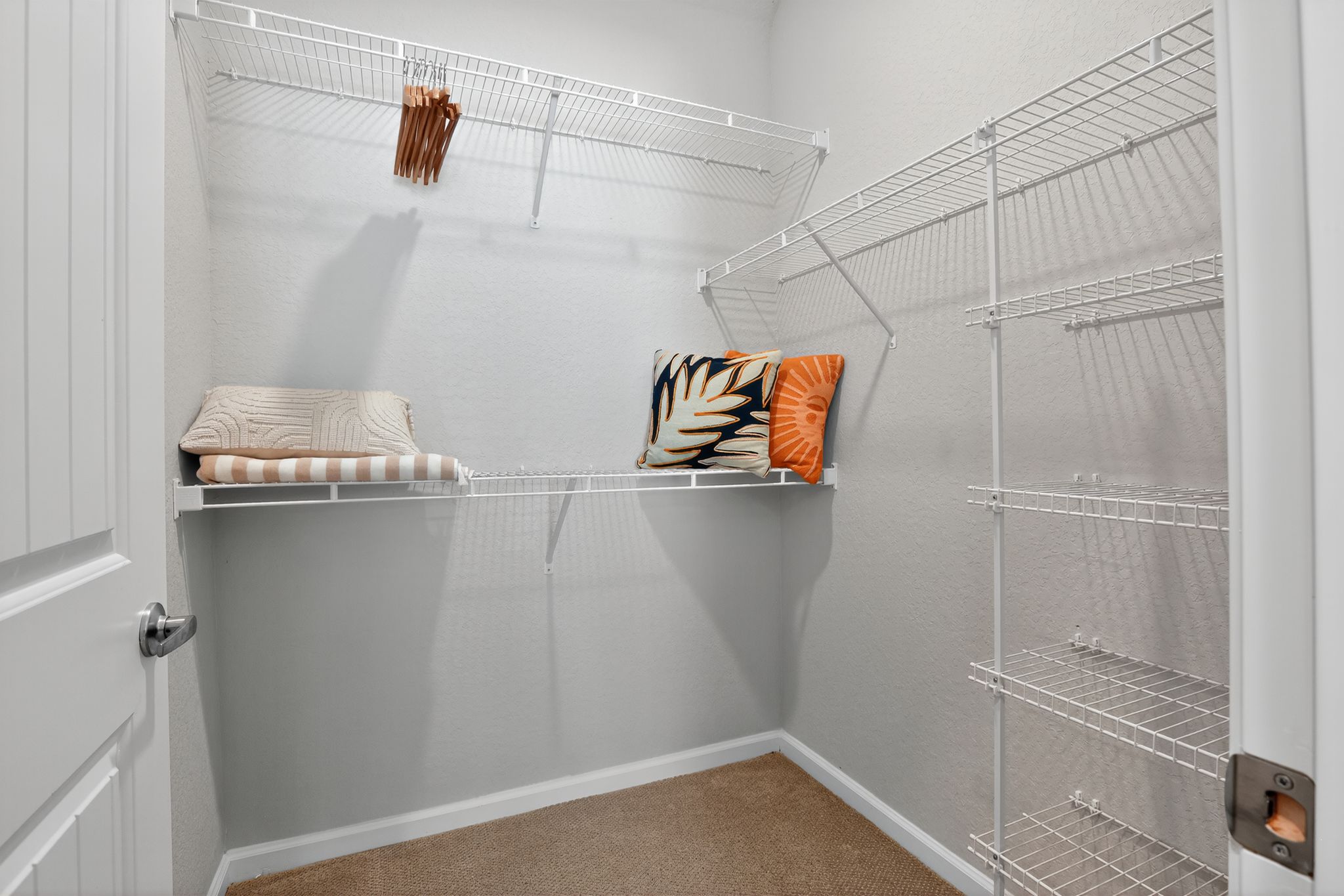 Empty closet with shelves and pillows