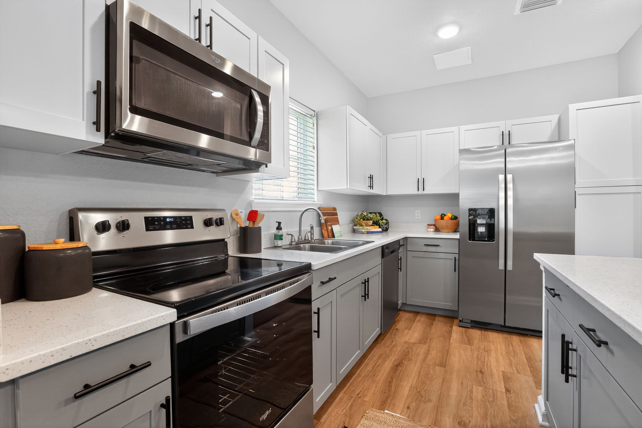 Modern kitchen with stainless appliances.