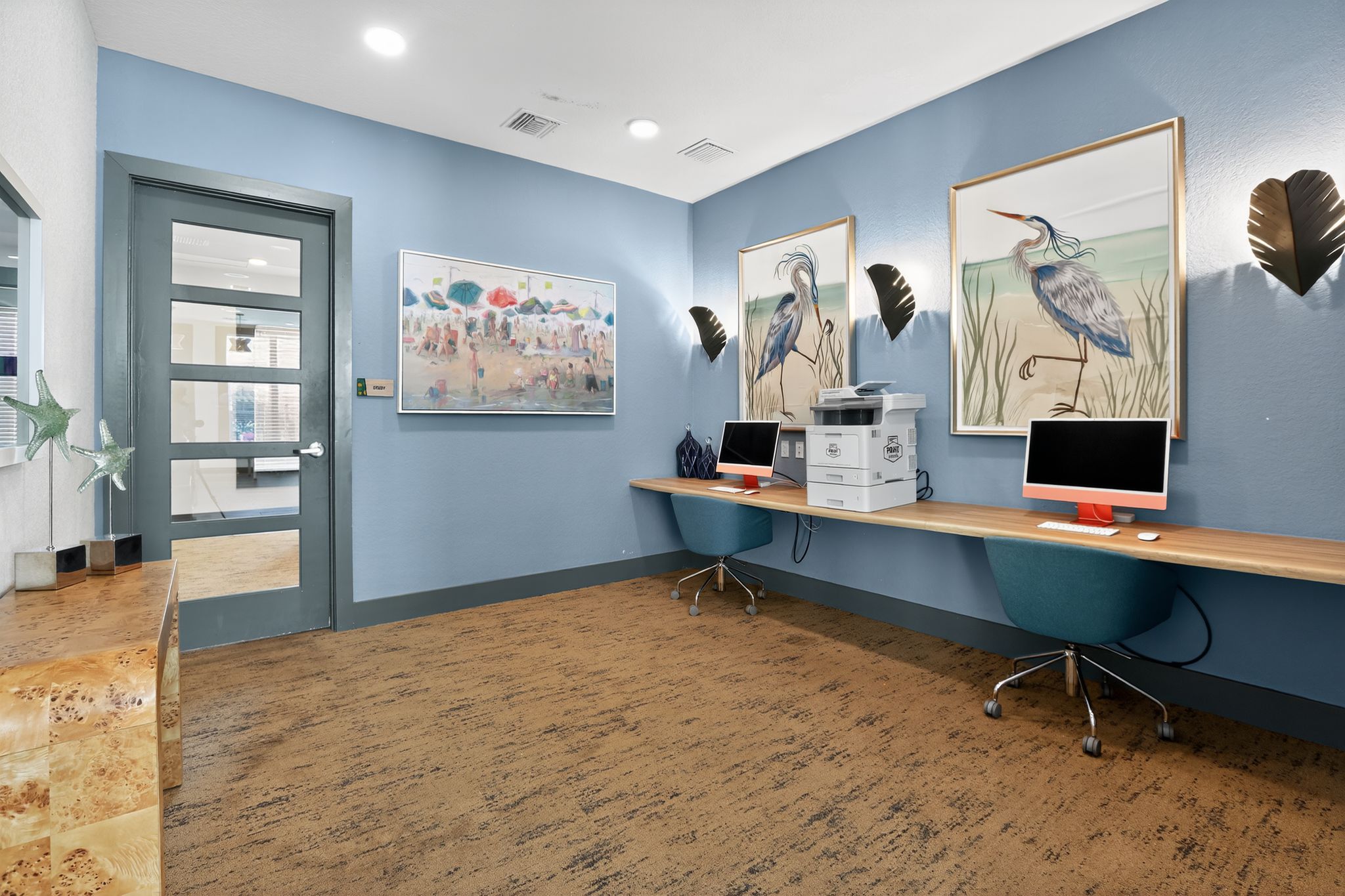 Modern workspace with art and computers