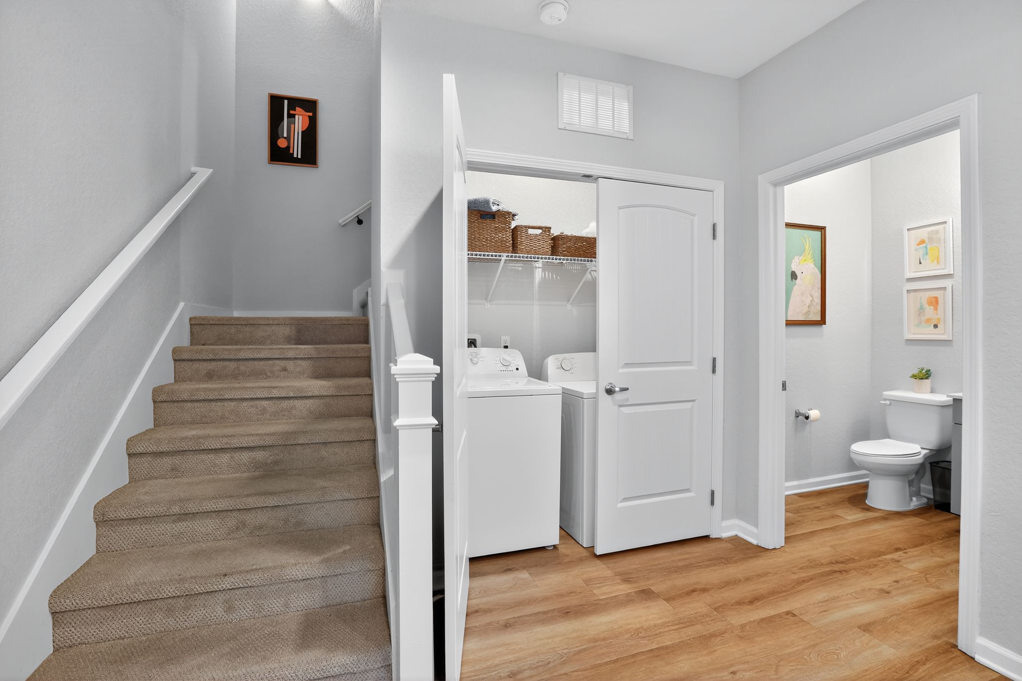 Stairs leading to laundry and bathroom