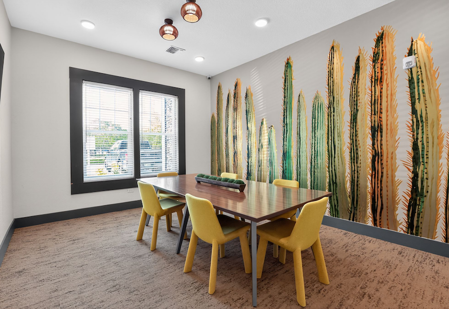 Modern study room with cactus mural